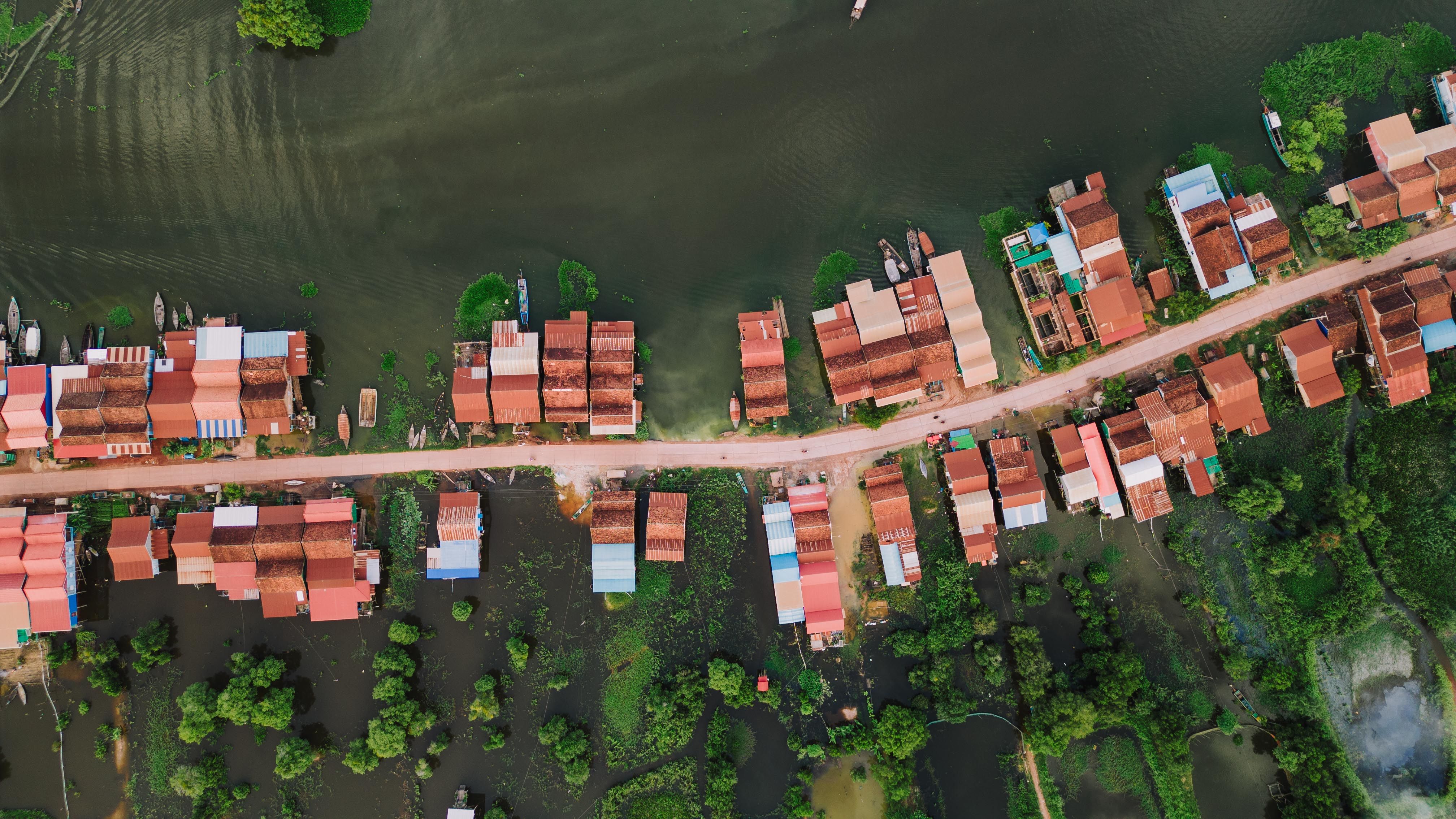 Aerial view of Kampong Khleang floating village with colorful stilt houses in Cambodia